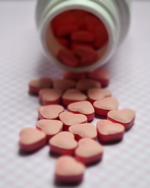 selective focus photo of pink tablets